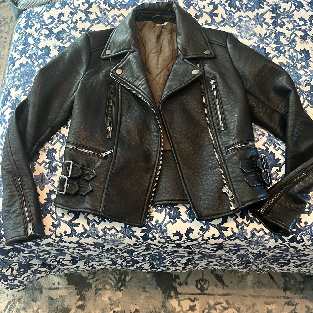 Free people “leather-look” jacket (100% polyester)